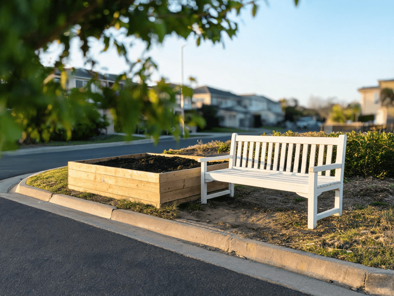 New raised garden bed and freshly repainted bench on a neighborhood corner